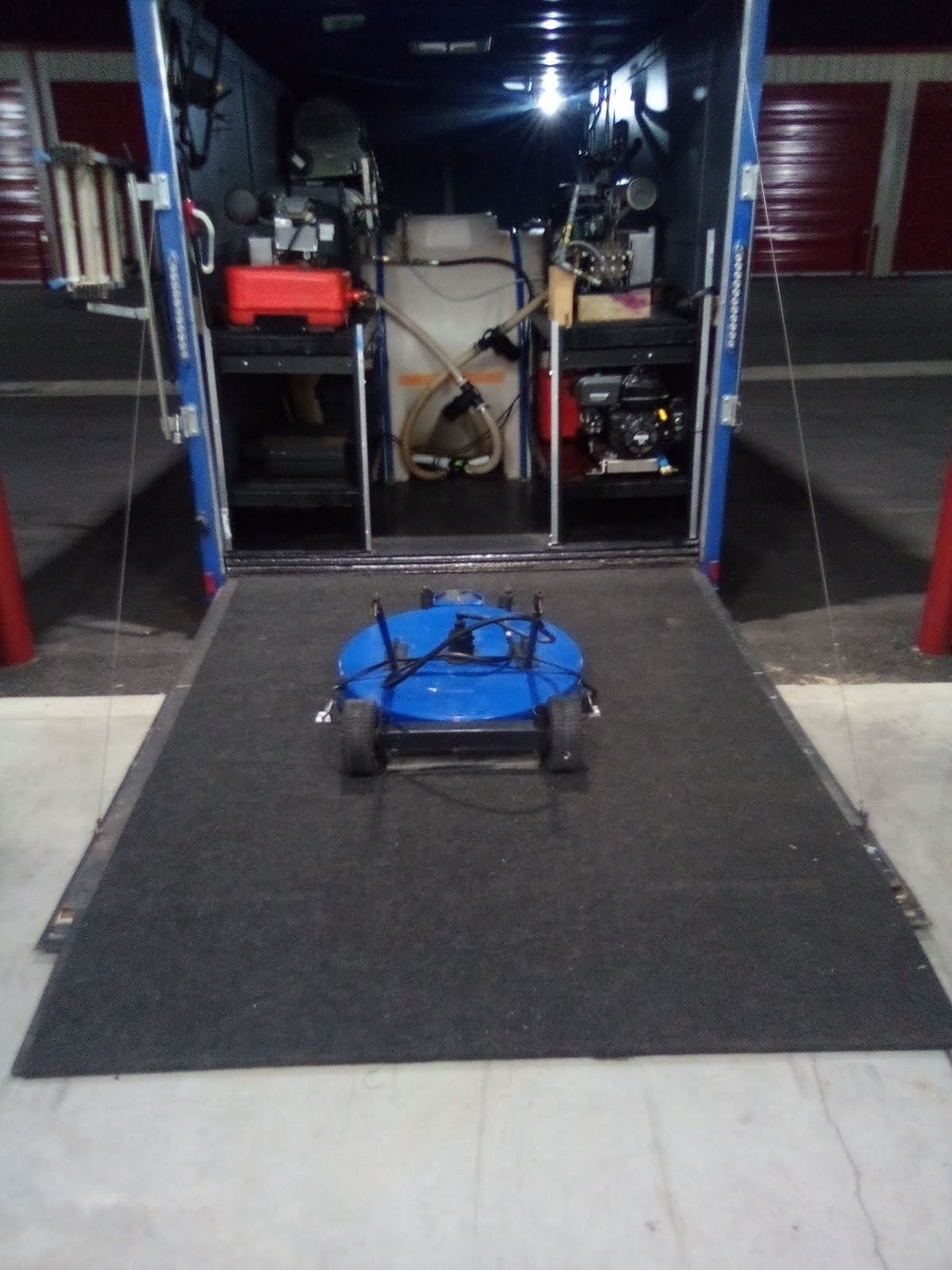 Surface cleaner staged on the trailer ramp